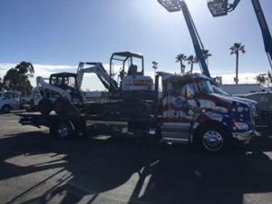 gallery- flatbed truck hauling equipment