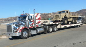 gallery- lowbed hauling hummer tank